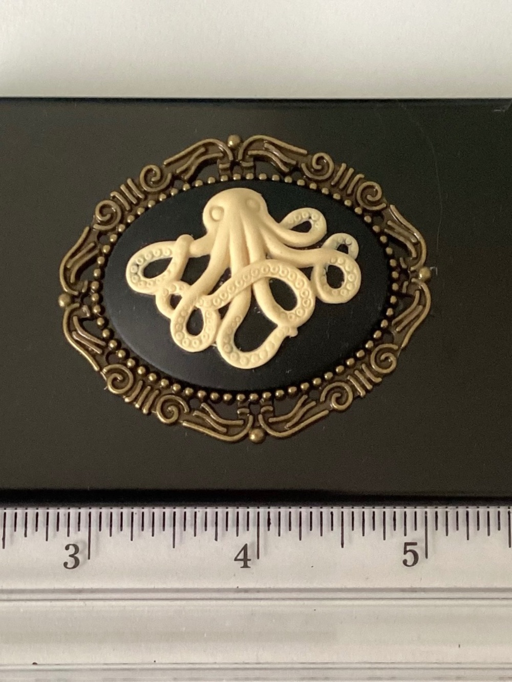 Black hard metal case w/“scary” octopus! Cigs, credit cards, meds, etc…OOAK